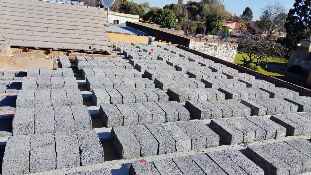 Precast concrete blocks laid out to cure in a yard